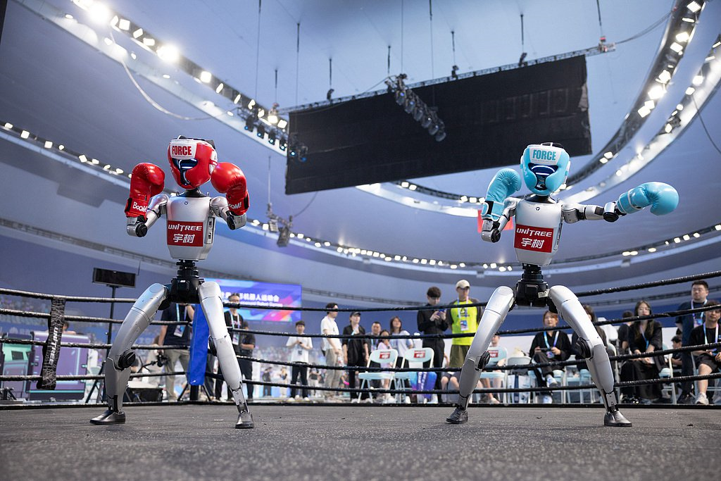 The robots showcase boxing and combat skills at the opening ceremony, August 14, 2025.