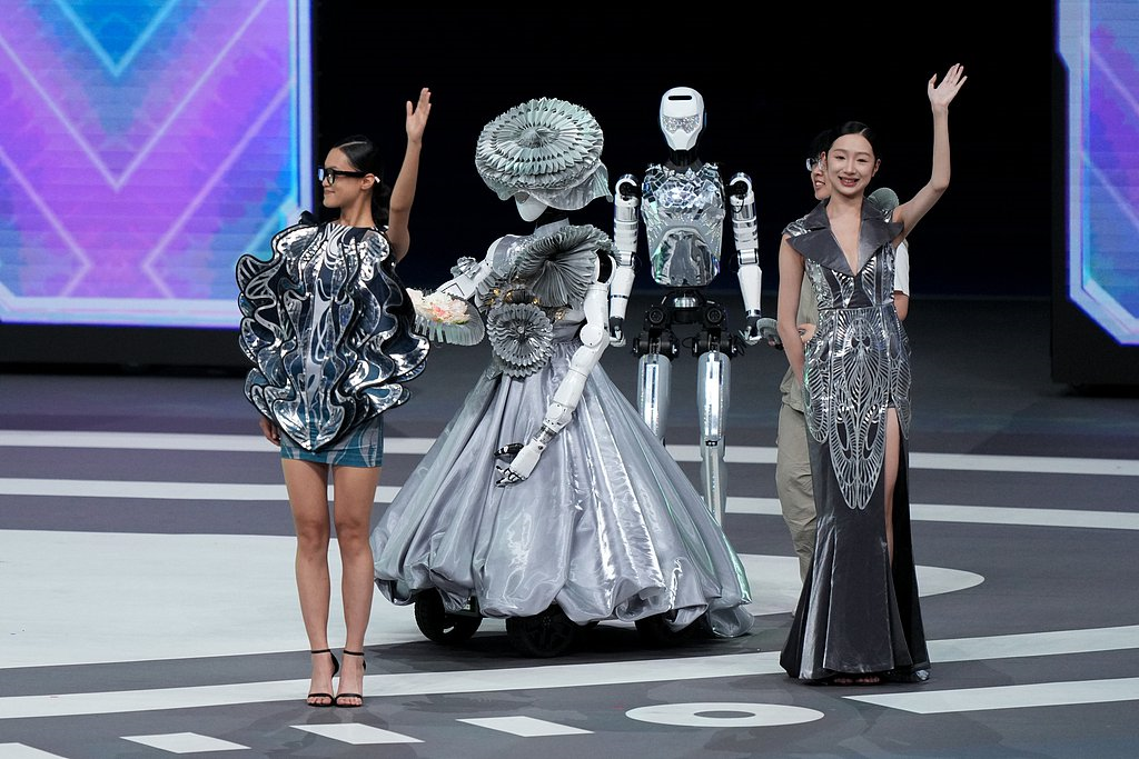 The robots in a fashion show at the opening ceremony, August 14, 2025.