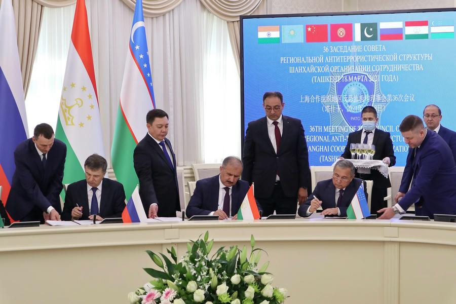 Delegates sign documents at the 36th meeting of the Council of the Regional Anti-Terrorist Structure (RATS) of the Shanghai Cooperation Organization (SCO) in Tashkent, Uzbekistan, March 18, 2021. (Photo by Zafar Khalilov/Xinhua)