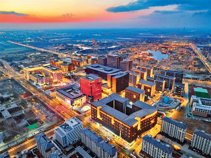 Nighttime view of a business services center in Xiong’an New Area, Hebei Province, March 15, 2025. The establishment of Xiong’an New Area represents a major policy decision by the CPC Central Committee with Xi Jinping at its core. The 14th Five-Year Plan sets out important arrangements for applying high standards in the construction of the area. Evolving from a blank canvas to a thriving reality, this city of the future is now enjoying rapid growth. PHOTO BY XINHUA REPORTER MU YU